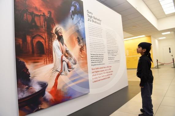 Darshan Singh, six looks at his dads Painting.A Sikh art exhibition which brings together the work of renowned Canadian artist Kanwar Singh and art from young volunteers from Slough is launching at the Guru Maneyo Granth Gurdwara.Guru Maneyo Granth Gurdwara, Bath Rd, Slough