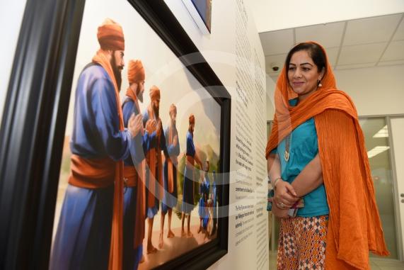 Cllr Madhuri Bedi looks at a Kanwar Singh painting.A Sikh art exhibition which brings together the work of renowned Canadian artist Kanwar Singh and art from young volunteers from Slough is launching at the Guru Maneyo Granth Gurdwara.Guru Maneyo Granth Gurdwara, Bath Rd, Slough