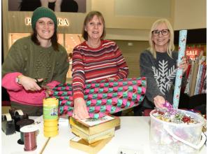 Volunteers wrap gifts in Maidenhead's Nicholsons Centre to raise funds for Thames Hospice