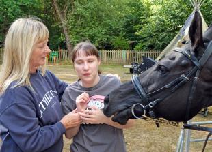 Horsing around: Racehorse visits children’s special needs day centre