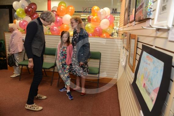 Maidenhead and Me presentation &ndash; Prime Minister Theresa May awarding the prizes and pix of people looking at the exhibition etc. Unit 26 Nicholsons Centre,Maidenhead                         