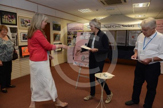 Maidenhead and Me presentation &ndash; Prime Minister Theresa May awarding the prizes and pix of people looking at the exhibition etc. Unit 26 Nicholsons Centre,Maidenhead                         