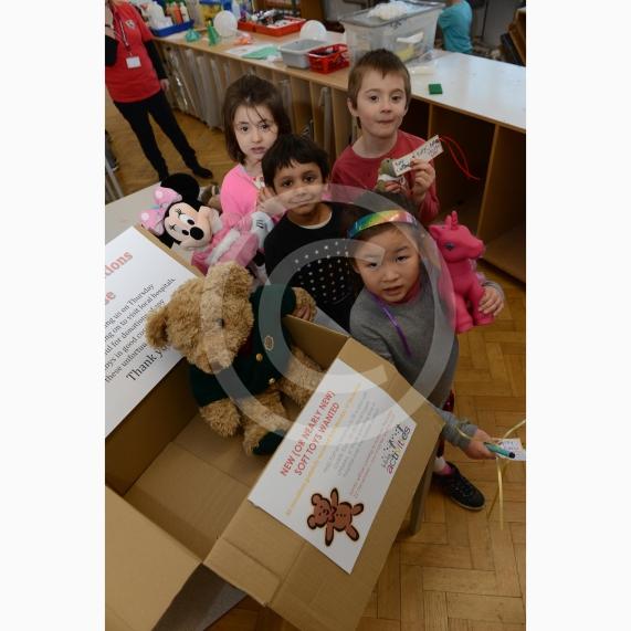 L-R Caitlin Limb 5, Sebastian Bose 6, Morgan Munn 6, Leonie Trinh 6. College Avenue, Maidenhead. Claires Court holiday club. Children will be giving presents to santa and he will be giving them to poorly children in hospital. Children bring toys with a Christmas wish or message, to personalise the gift. 