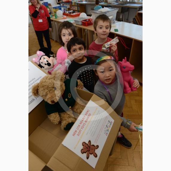 L-R Caitlin Limb 5, Sebastian Bose 6, Morgan Munn 6, Leonie Trinh 6. College Avenue, Maidenhead. Claires Court holiday club. Children will be giving presents to santa and he will be giving them to poorly children in hospital. Children bring toys with a Christmas wish or message, to personalise the gift. 