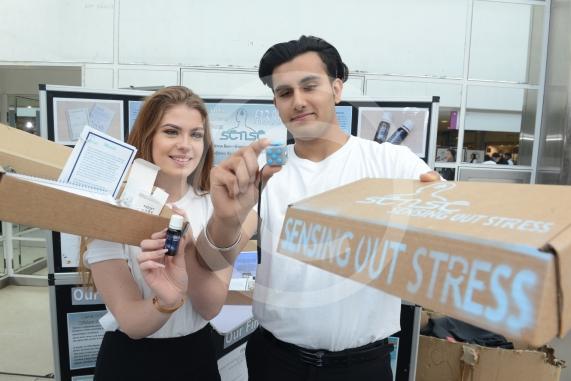 LtoR Georgia Wedgbury, 17, Sayan Gogia, 16. Burnham Grammar School.Young Enterprise stands.Queensmere Observatory Shopping Centre,Slough. 