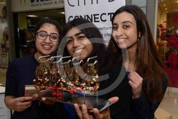 LtoR Nayanaa Prashar,17, Katherine Laza, 17, Arveen Graya,17. Herschel Grammar School. Young Enterprise stands.Queensmere Observatory Shopping Centre,Slough. 