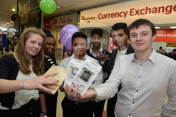 LtoR Tara Adams, 17, Jalisa Ogundelu, 16, Kim Amon, 16, Bliss Marques, 16, Johance Fernandes, 17, Michael Oxlade, 17. St Bernards School .Young Enterprise stands.Queensmere Observatory Shopping Centre,Slough. 