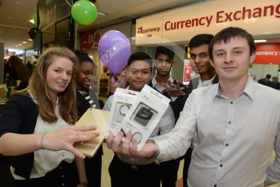 LtoR Tara Adams, 17, Jalisa Ogundelu, 16, Kim Amon, 16, Bliss Marques, 16, Johance Fernandes, 17, Michael Oxlade, 17. St Bernards School .Young Enterprise stands.Queensmere Observatory Shopping Centre,Slough. 