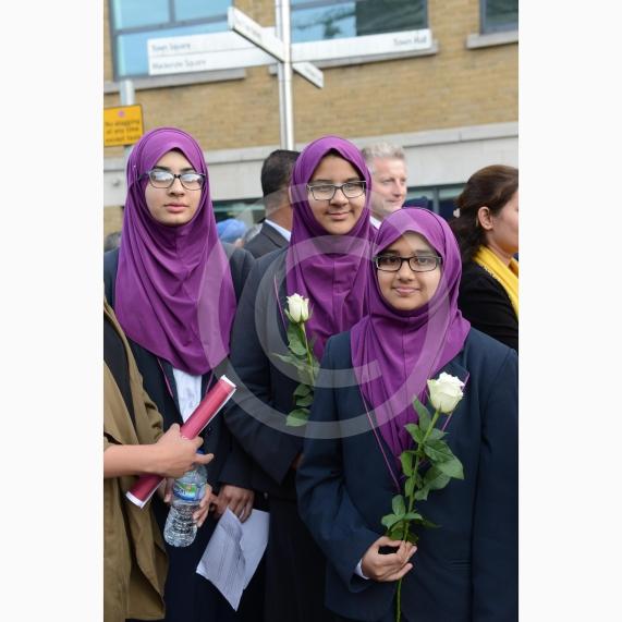 L-R Aish Tahir 14, Munaima Tafhimi 12, Sumayya Tafhimi 14 from Eden Girls' School. Slough High Street, Slough. A vigil in memory of the people who lost their lives in last night’s Manchester attack.
