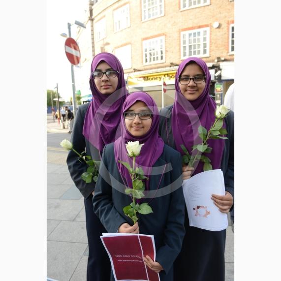 L-R Aish Tahir 14, Munaima Tafhimi 12, Sumayya Tafhimi 14 from Eden Girls' School. Slough High Street, Slough. A vigil in memory of the people who lost their lives in last night’s Manchester attack.