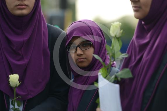 L-R Aish Tahir 14, Munaima Tafhimi 12, Sumayya Tafhimi 14 from Eden Girls' School. Slough High Street, Slough. A vigil in memory of the people who lost their lives in last night’s Manchester attack.