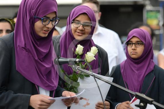 L-R Aish Tahir 14, Sumayya Tafhimi 14,  Munaima Tafhimi 12 from Eden Girls' School. Slough High Street, Slough. A vigil in memory of the people who lost their lives in last night’s Manchester attack.
