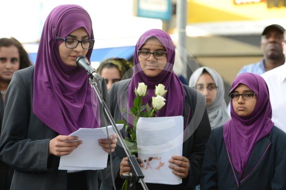 L-R Aish Tahir 14, Sumayya Tafhimi 14,  Munaima Tafhimi 12 from Eden Girls' School. Slough High Street, Slough. A vigil in memory of the people who lost their lives in last night’s Manchester attack.