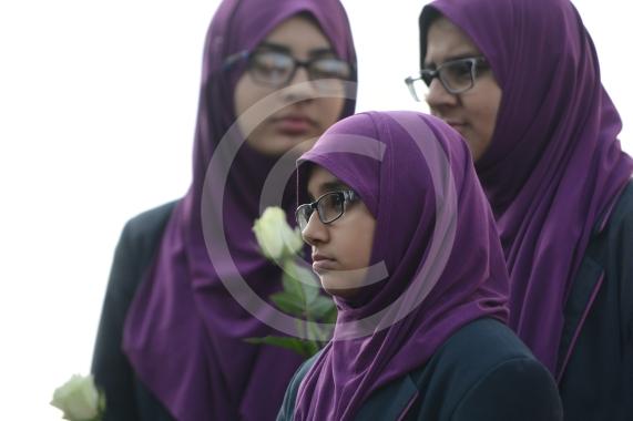 L-R Aish Tahir 14, Munaima Tafhimi 12, Sumayya Tafhimi 14 from Eden Girls' School. Slough High Street, Slough. A vigil in memory of the people who lost their lives in last night’s Manchester attack.
