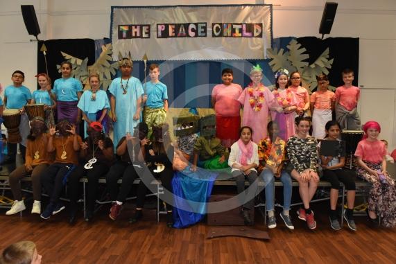 Cippenham Primary School, Elmshott Lane, Cippenham. Year six pupils at Cippenham Primary School are running through their dress rehearsal for this year’s play ‘The Peace Child’ which tells the story of two warring tribes separated by a raging river in the vibrant land of Mambika.