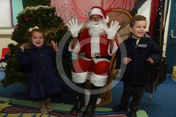 Chloe Kelly 3, Santa, Daniel Kelly 4. Cippenham Infant School, Dennis Way, Slough. A Christmas fair.
