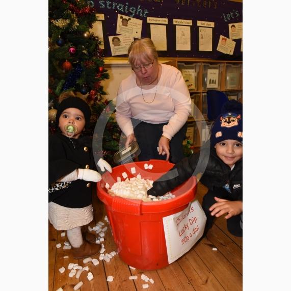 Remiyah Carty 1, Lesley Donnelly, Reyarn Carty 5. Cippenham Infant School, Dennis Way, Slough. A Christmas fair.