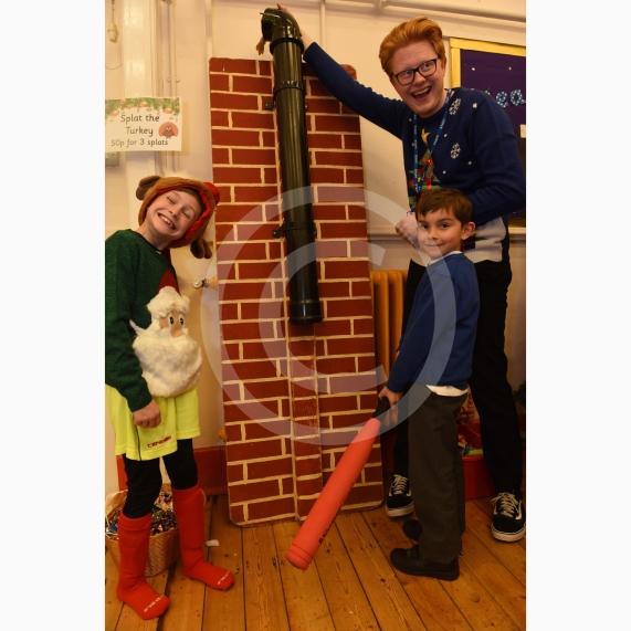 L-R Luke Smith 8, Oakley Tibballs 5, Mr Overton.Cippenham Infant School, Dennis Way, Slough. A Christmas fair.