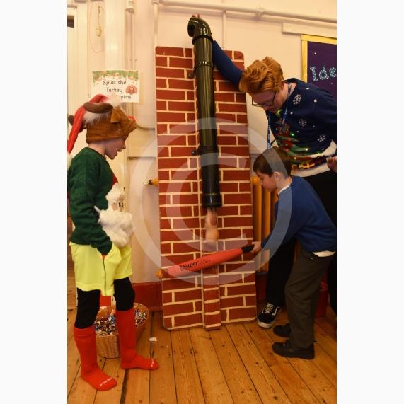 L-R Luke Smith 8, Oakley Tibballs 5, Mr Overton.Cippenham Infant School, Dennis Way, Slough. A Christmas fair.