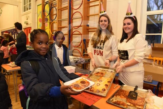 L-R Zuriel Ujani 8, Zamar Ujani 9, Miss Statters, Miss Darvy. Cippenham Infant School, Dennis Way, Slough. A Christmas fair.