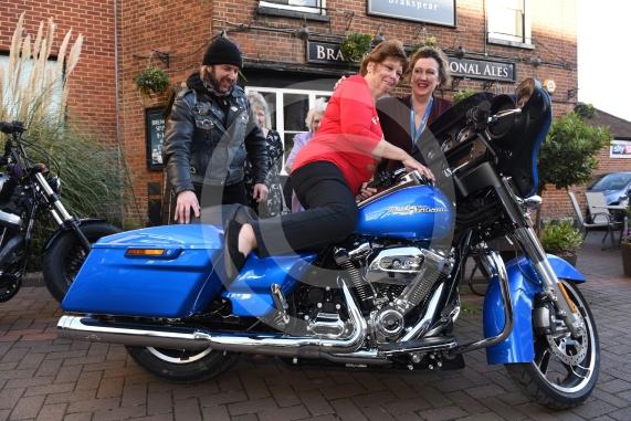 The Vine pub, Market Street, Maidenhead. Christmas lunch for the elderly at the Vine pub and there’s going to be some guys turning up with Harley Davidsons (Reading Harley Davidson). Linda Watson on the Harley