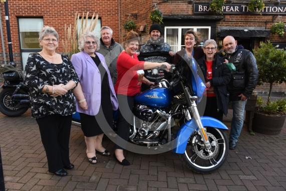 The Vine pub, Market Street, Maidenhead. Christmas lunch for the elderly at the Vine pub and there’s going to be some guys turning up with Harley Davidsons (Reading Harley Davidson). Linda Watson on the Harley