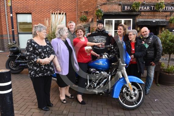 The Vine pub, Market Street, Maidenhead. Christmas lunch for the elderly at the Vine pub and there’s going to be some guys turning up with Harley Davidsons (Reading Harley Davidson). Linda Watson on the Harley