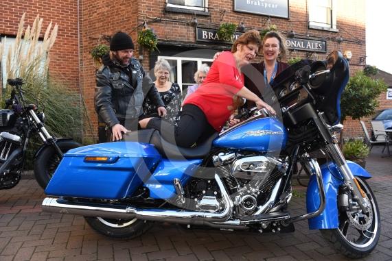 The Vine pub, Market Street, Maidenhead. Christmas lunch for the elderly at the Vine pub and there’s going to be some guys turning up with Harley Davidsons (Reading Harley Davidson). Linda Watson on the Harley