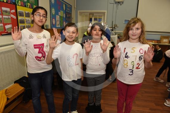 Cippenham Primary School, Elmshott Lane, Cippenham. Children are wearing items of clothing with a number or mathematical symbol on to raise money for the NSPCC as part of the the charity&rsquo;s &lsquo;Number Day&rsquo; campaign.L-R Zoya Avais 9, Steve Caley 10, Jessica Jerram 9, Faseeha Shahzad 9.