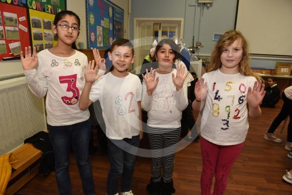 Cippenham Primary School, Elmshott Lane, Cippenham. Children are wearing items of clothing with a number or mathematical symbol on to raise money for the NSPCC as part of the the charity&rsquo;s &lsquo;Number Day&rsquo; campaign.L-R Zoya Avais 9, Steve Caley 10, Jessica Jerram 9, Faseeha Shahzad 9.