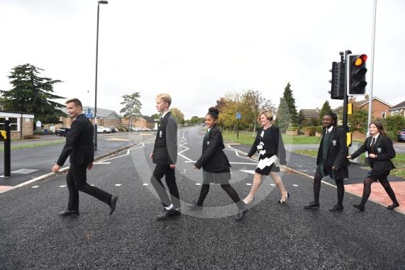 Headteacher, Frances Walsh, and some children by the traffic light crossing outside the school. The school have had an application to install double yellow lines approved.Cox Green School, Highfield Lane, Maidenhead 