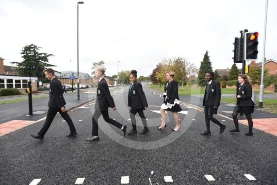 Headteacher, Frances Walsh, and some children by the traffic light crossing outside the school. The school have had an application to install double yellow lines approved.Cox Green School, Highfield Lane, Maidenhead 