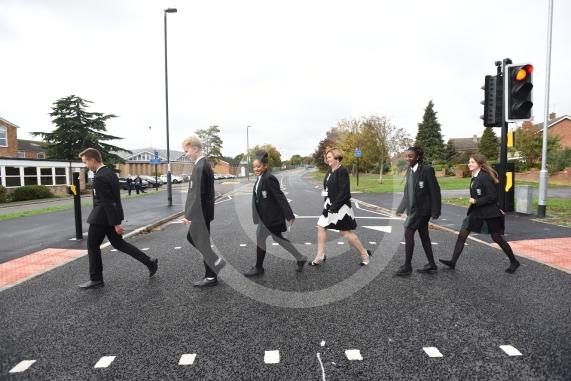 Headteacher, Frances Walsh, and some children by the traffic light crossing outside the school. The school have had an application to install double yellow lines approved.Cox Green School, Highfield Lane, Maidenhead 