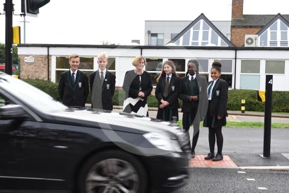 Headteacher, Frances Walsh, and some children by the traffic light crossing outside the school. The school have had an application to install double yellow lines approved.Cox Green School, Highfield Lane, Maidenhead 
