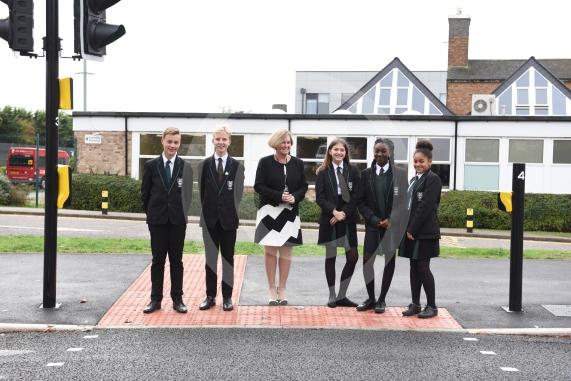 Headteacher, Frances Walsh, and some children by the traffic light crossing outside the school. The school have had an application to install double yellow lines approved.Cox Green School, Highfield Lane, Maidenhead 
