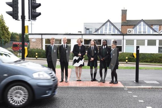 Headteacher, Frances Walsh, and some children by the traffic light crossing outside the school. The school have had an application to install double yellow lines approved.Cox Green School, Highfield Lane, Maidenhead 