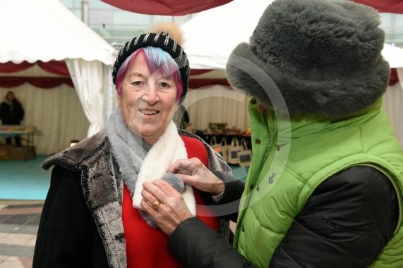 Pauline Attree tries a new scarf on.Slough Borough Council&rsquo;s Festive Fun event.Slough Town Square and Slough High Street.