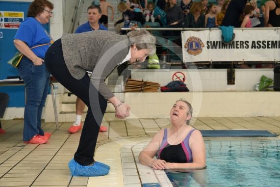 Prime Minister Theresa May talks to Sonya Clarke.The Prime Minister Theresa May and Philip May visit the 34th Maidenhead Swimarathon at the  Magnet Leisure Centre, Holmanleaze, Maidenhead. 