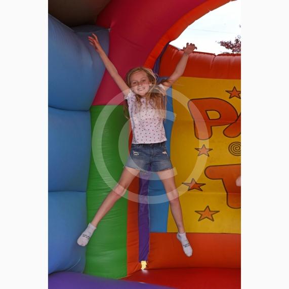 Izzy Fisher (9) on the bouncy castle. Sonning Street Party held to mark 75 years since D-Day. Picture by Emma Sheppard
