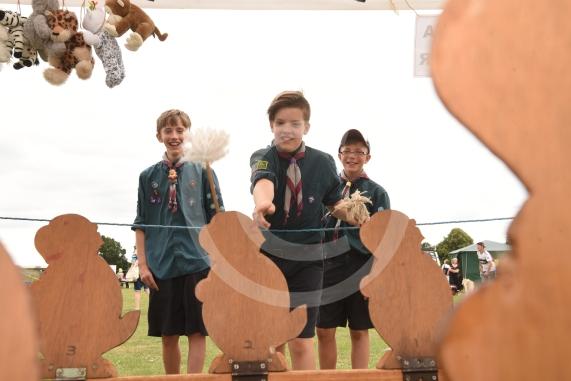 Ltor Anakin Shrewsbury, 13, Adam Gadziala, 11 and George Lacey, 11 play the Bash the Beaver game.Cippenham Carnival, Mercian Way Park, Slough.