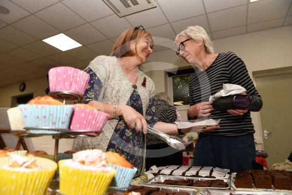 Sue Marsden buys cakes from Angela Plant at the cake stall.Cookham Dean Church Autumn Fair.Cookham Dean Village Hall, Cookham Dean.