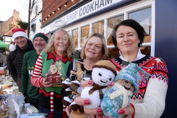 LtoR Tony Simpson, Andy Braggins, Helen Braggins and Magda Wencel from the Teapot Tea Shop.Cookham Christmas Street Fayre 2019, High Street, Cookham.