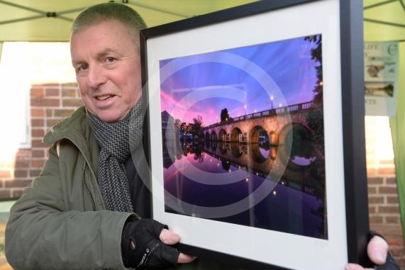 Mick Vogel from Cookham Wildlife Photography with his photograph of Maidenhead bridge.Cookham Christmas Street Fayre 2019, High Street, Cookham.        