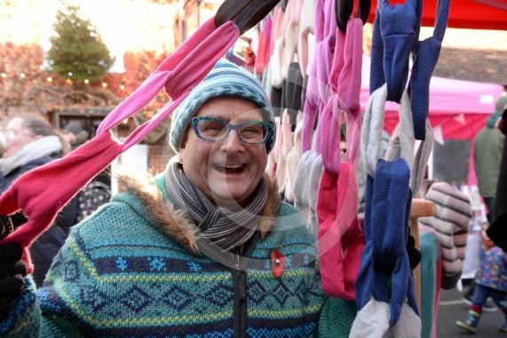 Timmy Mallett looks at one of the many stalls at the Cookham Christmas Street Fayre 2019, High Street, Cookham.