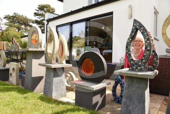 Jill Chadwick looks through one of her sculptures.Cookham and Maidenhead Arts Trail, Altwood Bailey, Maidenhead.Altwood Bailey, Maidenhead.