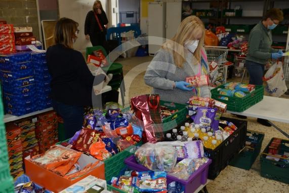 Christmas feature on Maidenhead Foodshare. They are bundling up some food bags to send out today. Maidenhead Food Share, in old Niocholsons Tesco unit