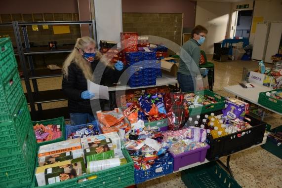 Christmas feature on Maidenhead Foodshare. They are bundling up some food bags to send out today. Maidenhead Food Share, in old Niocholsons Tesco unit