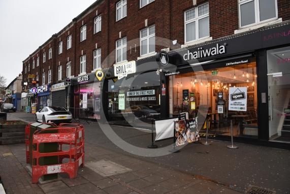 Grill Street owner Bilal Malik , has put up electronic awareness raising signs for COVID-19. Grill Street, 232 Farnham Rd, Slough 