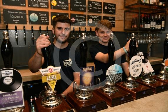 LtoR Aidan Taylor and Jake Stephenson pour some beers at the Windsor Beer Festival, Windsor and Eton Brewery, Units 1-4 , Vansittart Estate, Windsor.