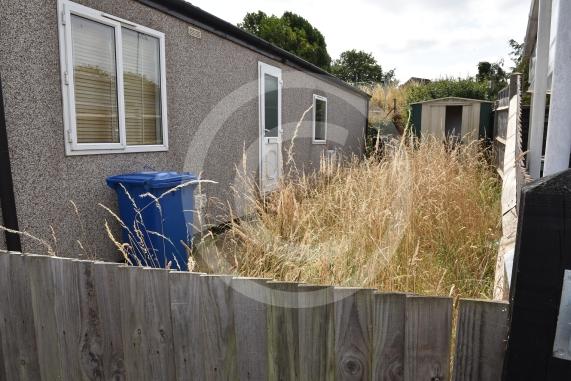 Brownfield Gardens, Maidenhead Susan Moorcock (75 years old) and Arthur Freeman (92 years old) live next door to another mobile home where they say the grass has gone dry and straw like and is as tall as their fence. 